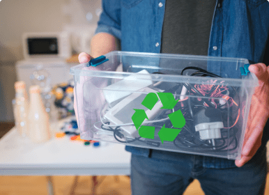 Recycled electronics in clear recycling bin